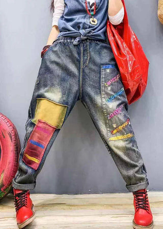 Jeans med farverigt patchwork og broderi
