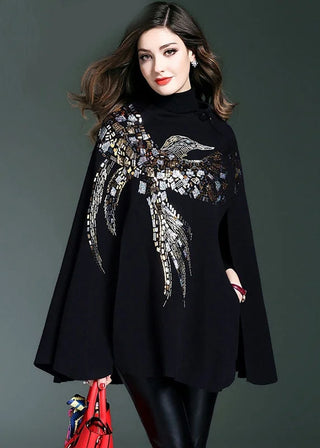 Sweater med glitrende fugl broderi